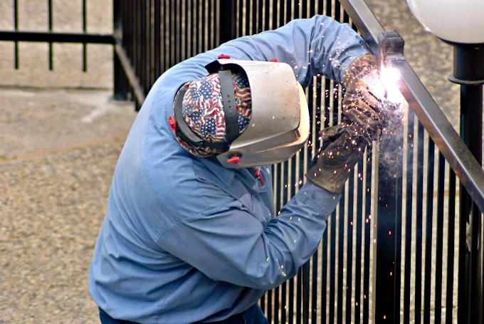 Professional fence craftsman welding in New Jersey
